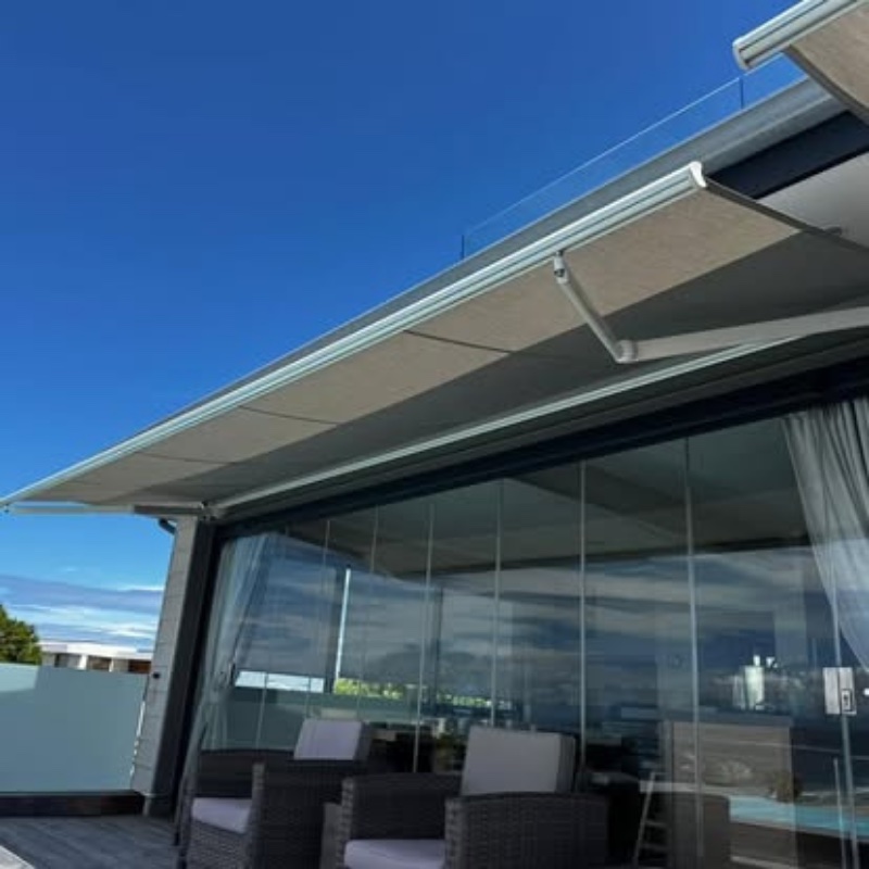 Retractable awning by Custom Blinds providing elegant shade over a Garden Route patio